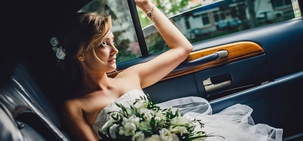 wedding bride riding in private chauffeur